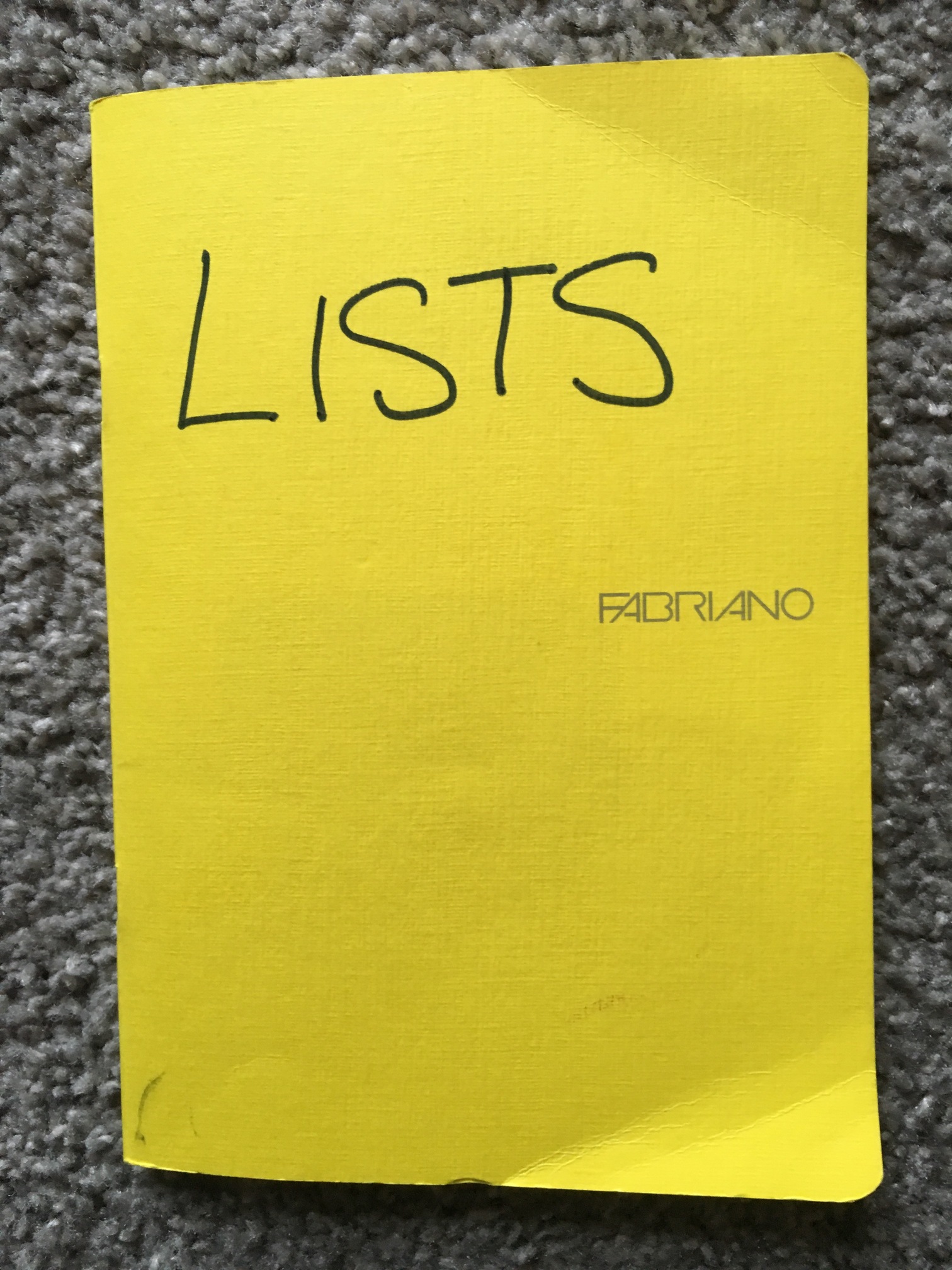 A yellow notebook full of lists to make you a more productive writer!